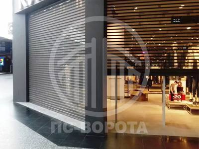 Рулонные стальные ворота из перфорированного профиля